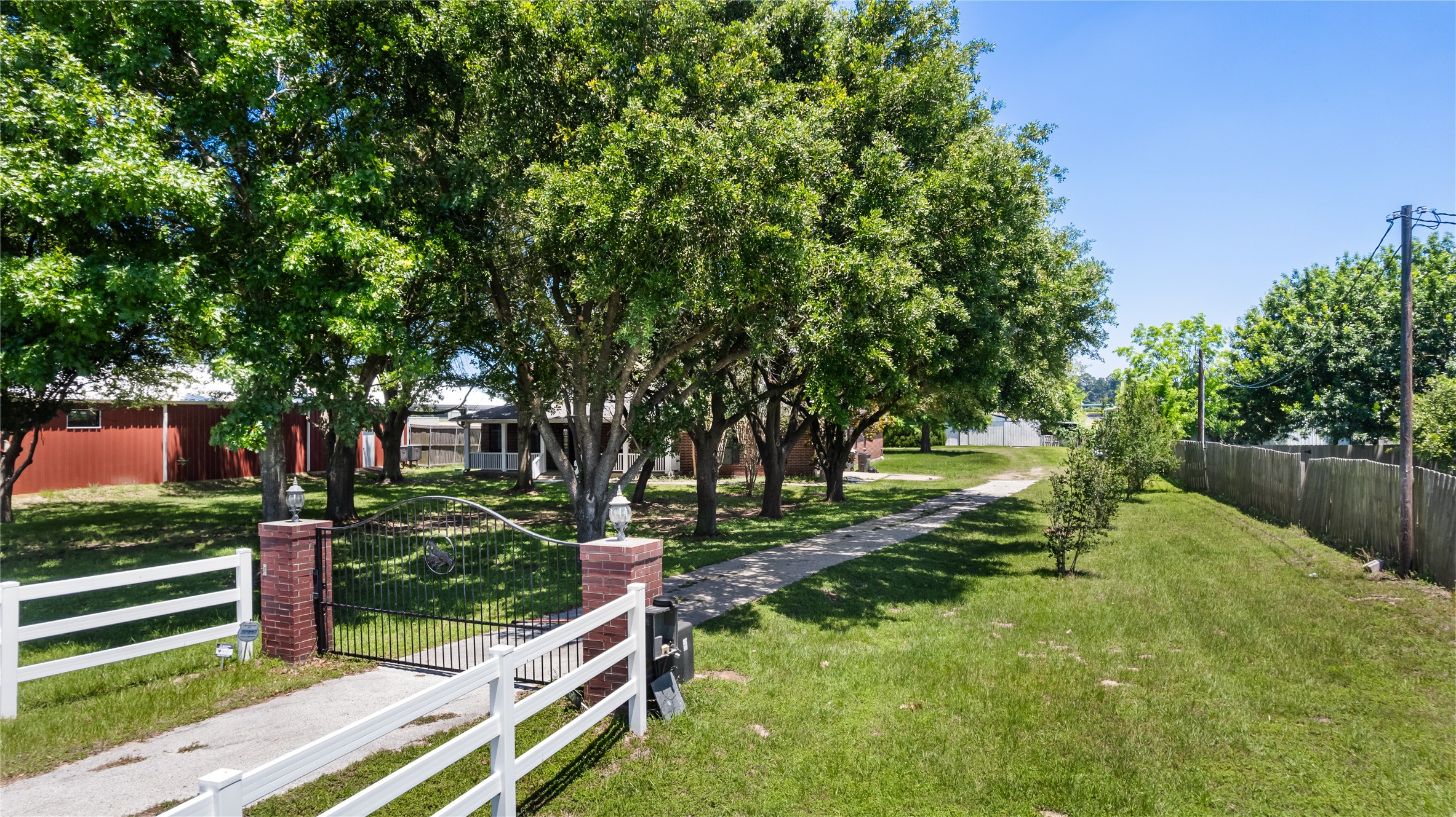20240 Cypress Rosehill Road Tomball, TX 77377 - Photo 11 of 26 a view of a backyard with large trees