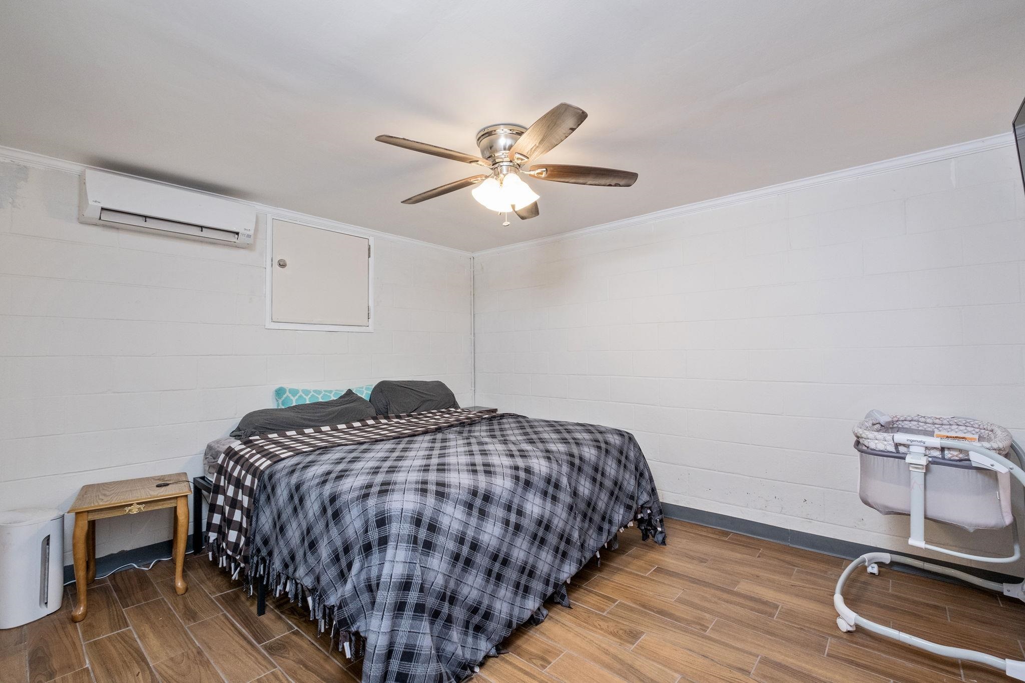 8208 George Wine Road Bridgewater, VA 22812 - Photo 12 of 27 a bedroom with a bed and a chandelier