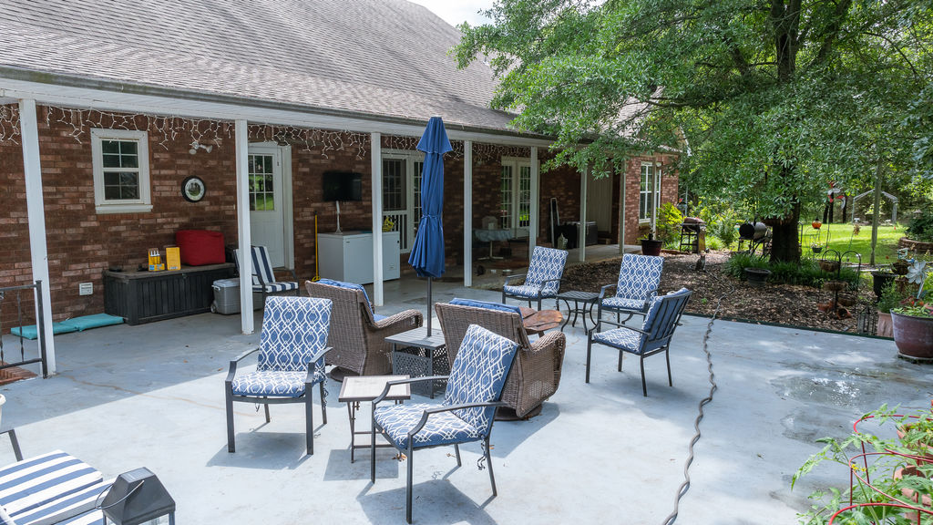365 Calihan Road Booneville, AR 72927 - Photo 9 of 59 Expansive concrete patio offering a covered area with a brick exterior