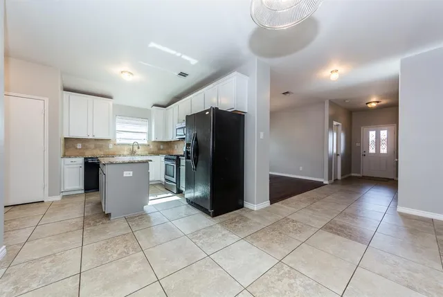a bathroom with a sink toilet and mirror