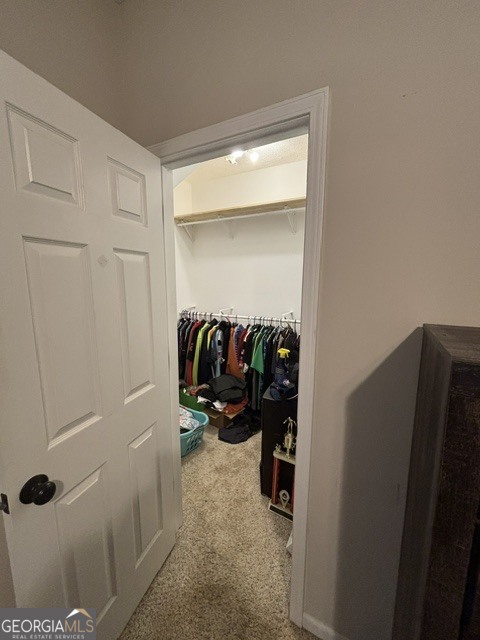 771 Hamilton Road Concord, GA 30206 - Photo 16 of 30 a view of walk in closet with clothes and shoes