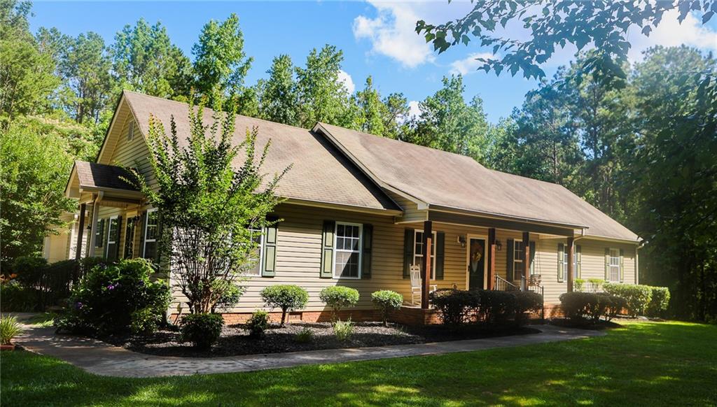 a front view of a house with garden