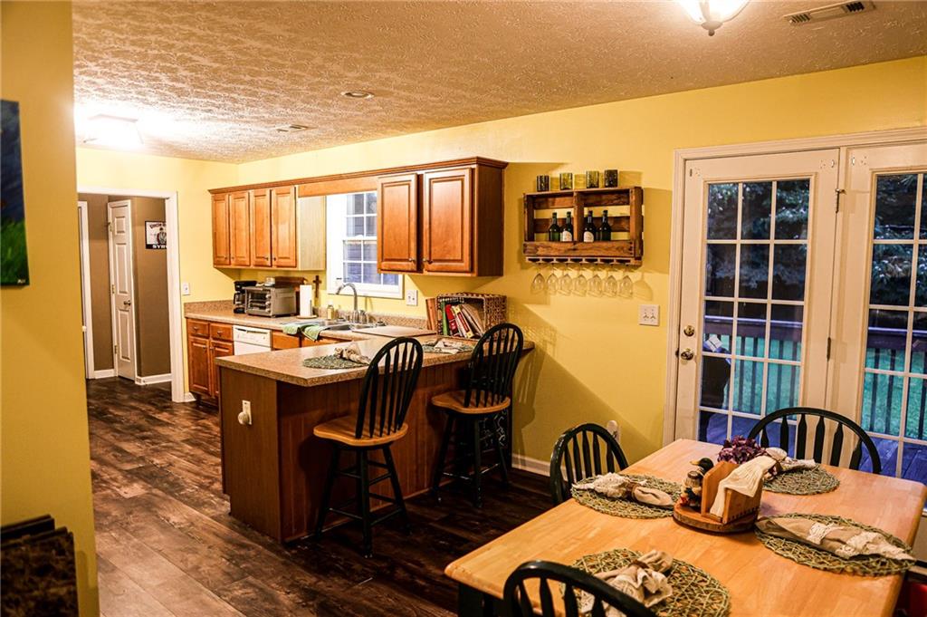 1665 Jackson Lake Road Mansfield, GA 30055 - Photo 11 of 16 a bedroom with furniture and a window