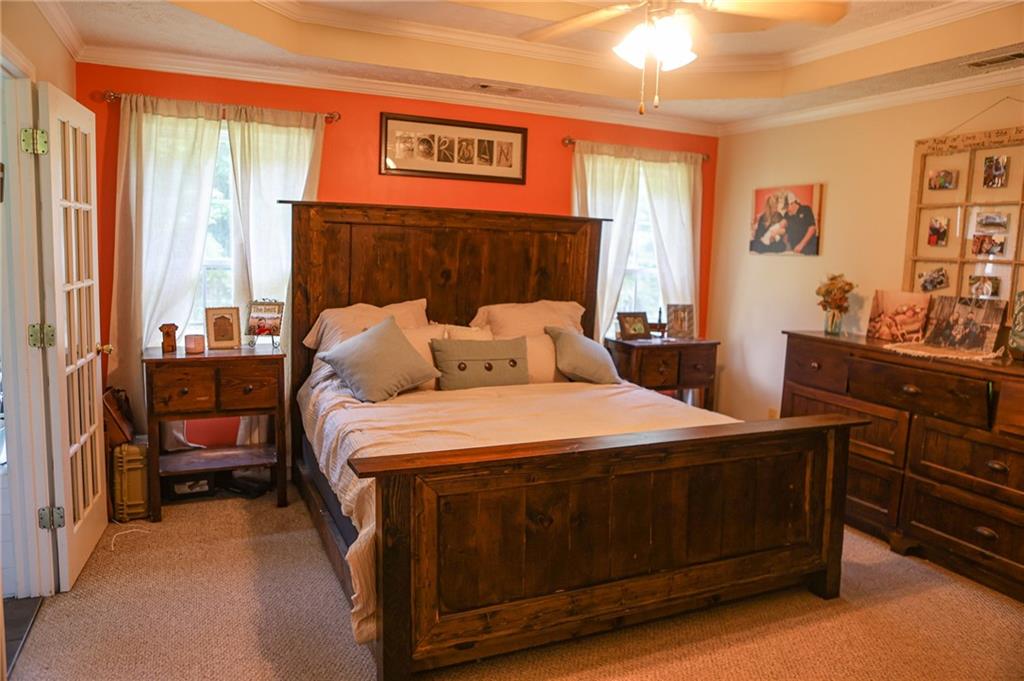 1665 Jackson Lake Road Mansfield, GA 30055 - Photo 13 of 16 a bedroom with a bed and a table