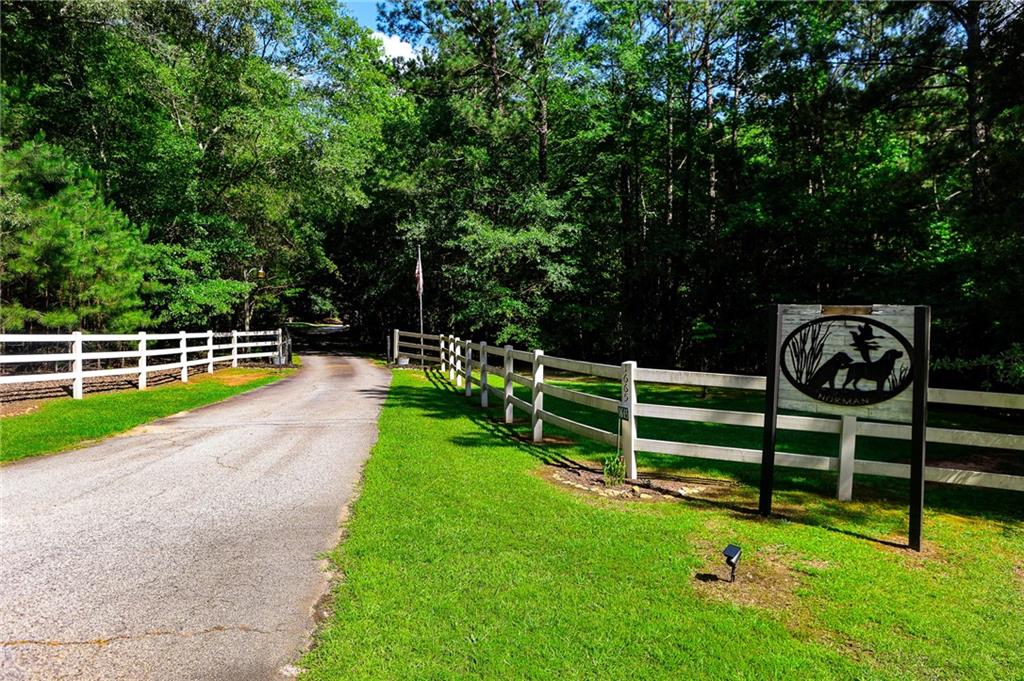 1665 Jackson Lake Road Mansfield, GA 30055 - Photo 2 of 16 a view of a park with wooden fence