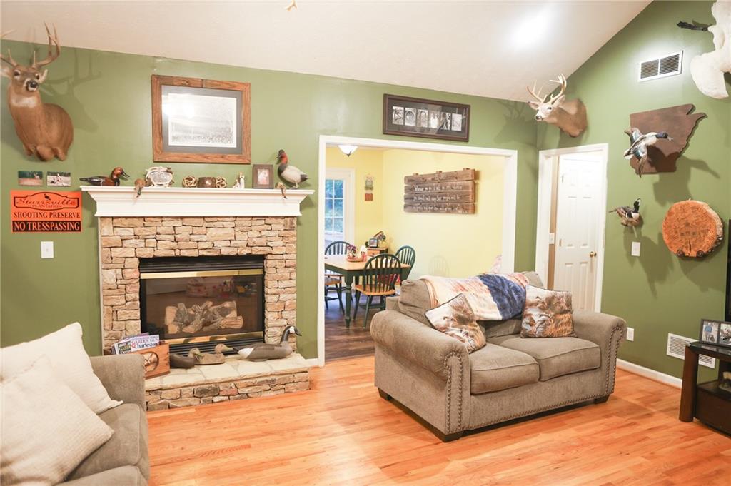 1665 Jackson Lake Road Mansfield, GA 30055 - Photo 3 of 16 a living room with furniture and a fireplace