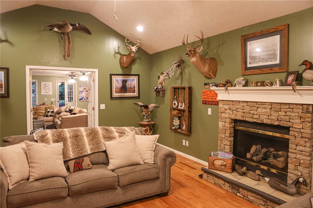 1665 Jackson Lake Road Mansfield, GA 30055 - Photo 5 of 16 a living room with furniture and a fireplace