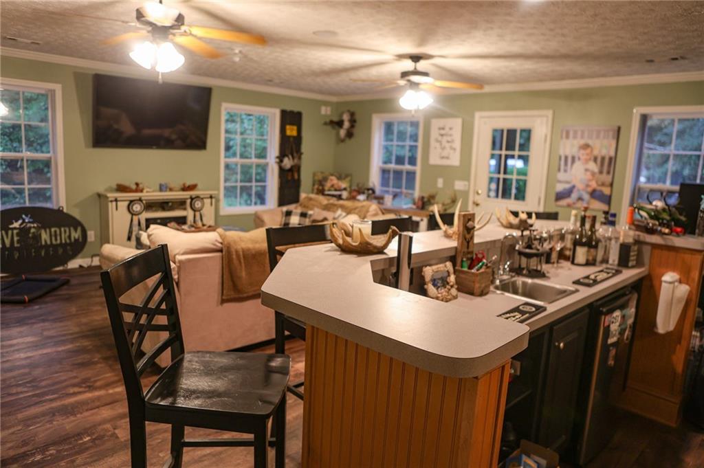 1665 Jackson Lake Road Mansfield, GA 30055 - Photo 8 of 16 a view of a dining room with furniture and wooden floor