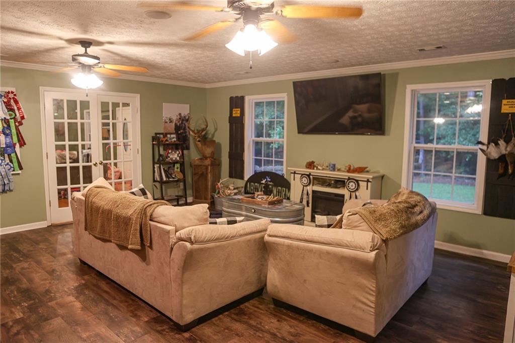 1665 Jackson Lake Road Mansfield, GA 30055 - Photo 9 of 16 a living room with furniture fireplace and flat screen tv