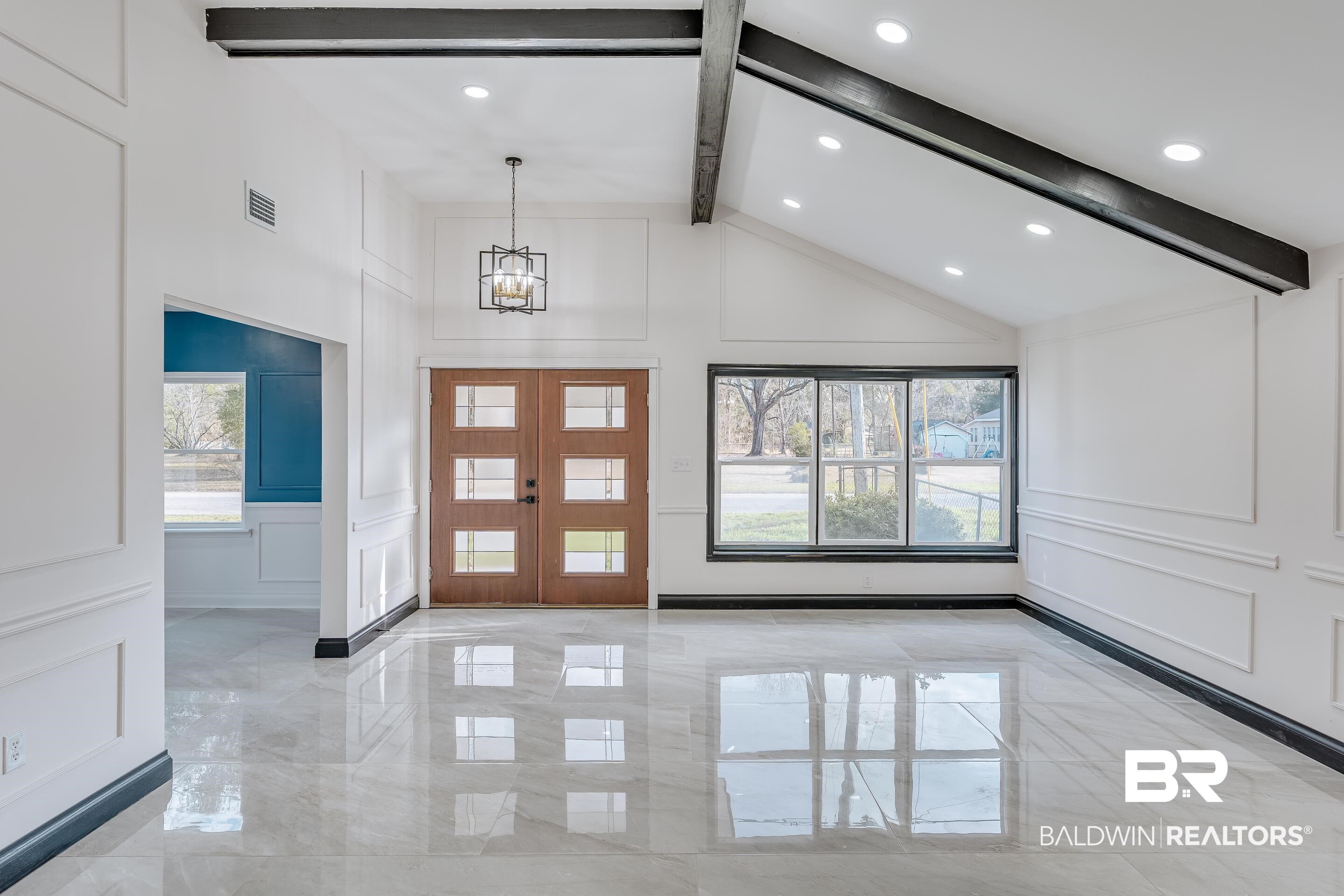 1190 Military Road Mount Vernon, AL 36560 - Photo 5 of 47 Entryway featuring a decorative wall, plenty of natural light, light marble finish floors, beamed ceiling, and a chandelier