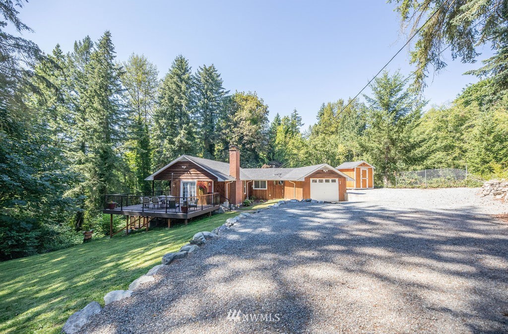 10627 Cherry Road Lake Stevens, WA 98258 - Photo 1 of 38 a front view of a house with a yard and trees