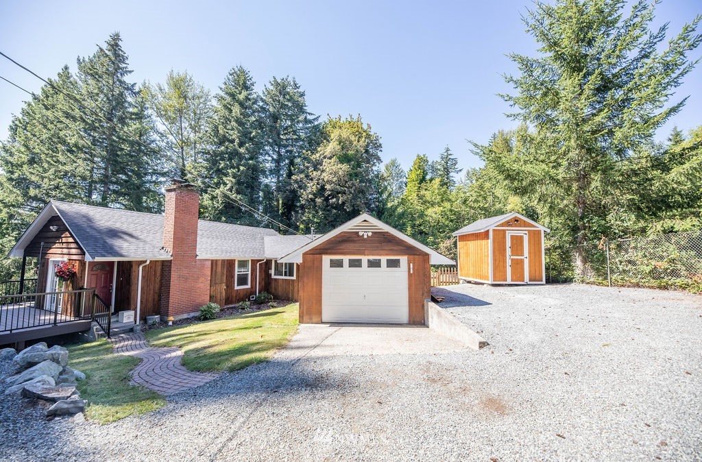 10627 Cherry Road Lake Stevens, WA 98258 - Photo 2 of 38 a front view of a house with a yard and garage