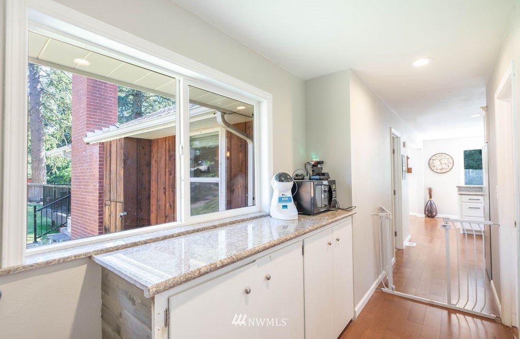 10627 Cherry Road Lake Stevens, WA 98258 - Photo 12 of 38 a kitchen with stainless steel appliances granite countertop a stove a sink and a refrigerator