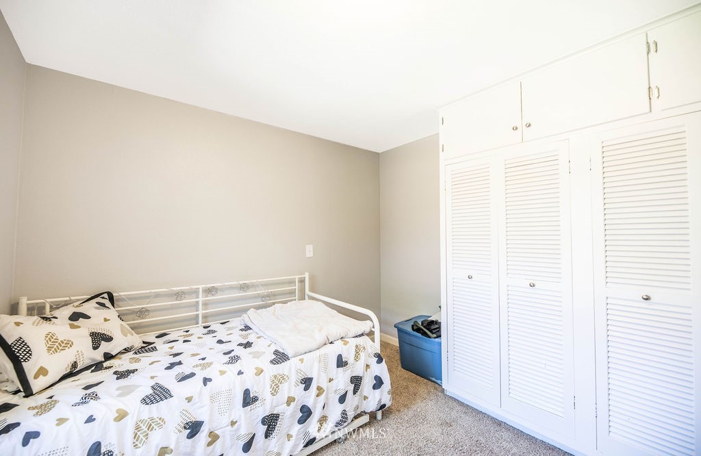 10627 Cherry Road Lake Stevens, WA 98258 - Photo 14 of 38 a bedroom with a bed and a window