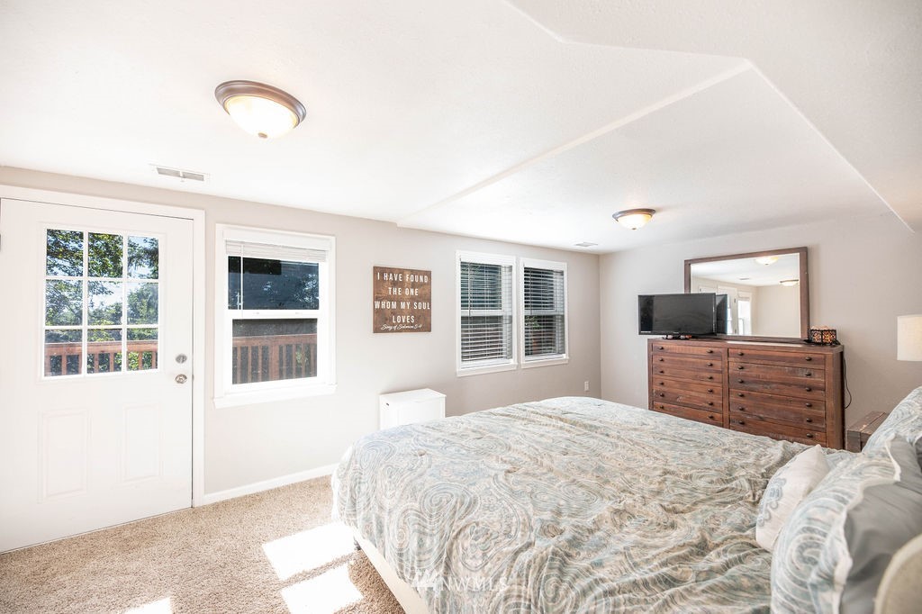 10627 Cherry Road Lake Stevens, WA 98258 - Photo 19 of 38 a bedroom with a bed and wooden floor