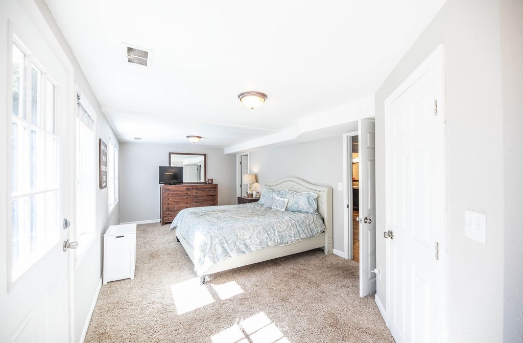 10627 Cherry Road Lake Stevens, WA 98258 - Photo 20 of 38 a spacious bedroom with a bed and a window