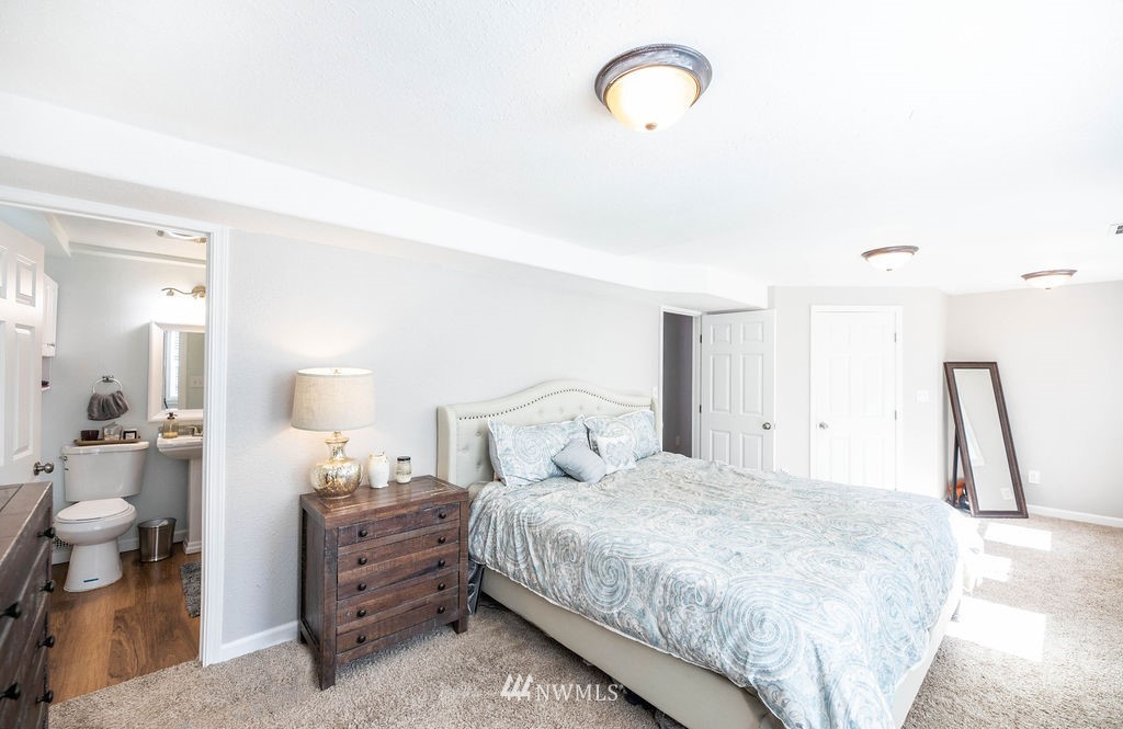 10627 Cherry Road Lake Stevens, WA 98258 - Photo 21 of 38 a bedroom with a bed and a cabinets