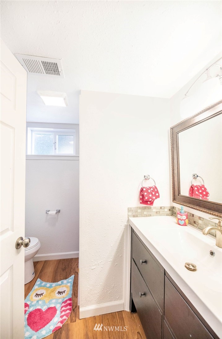 10627 Cherry Road Lake Stevens, WA 98258 - Photo 24 of 38 a bathroom with a sink and a mirror