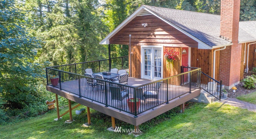 10627 Cherry Road Lake Stevens, WA 98258 - Photo 27 of 38 a view of a wooden deck with a yard