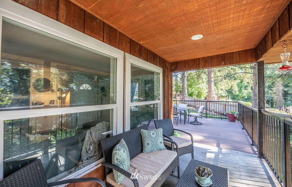 10627 Cherry Road Lake Stevens, WA 98258 - Photo 31 of 38 a balcony with furniture and wooden floor
