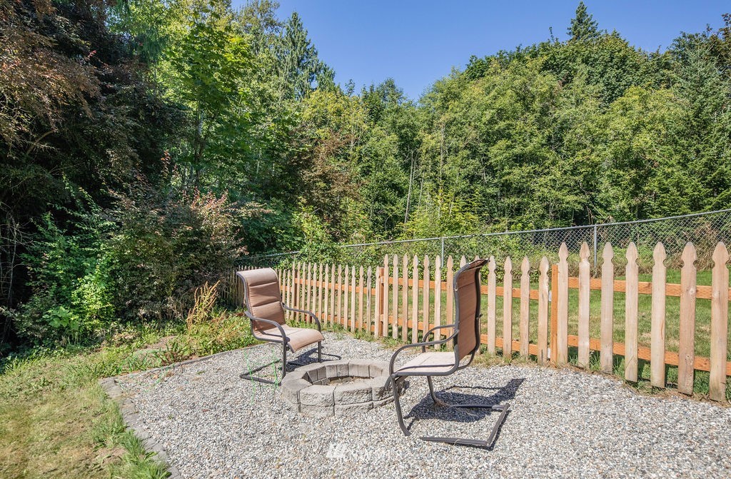 10627 Cherry Road Lake Stevens, WA 98258 - Photo 32 of 38 a view of a patio with a table and chairs