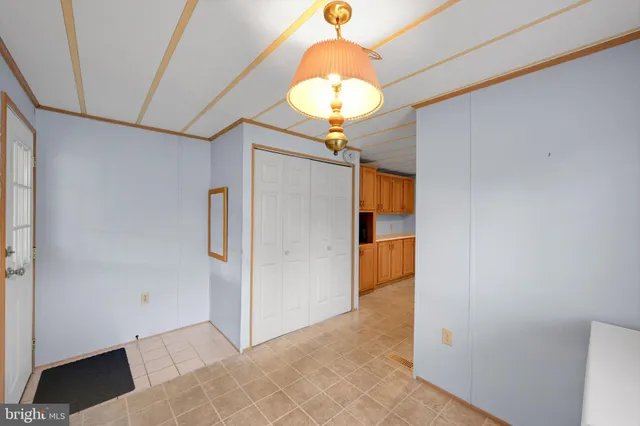 a view of a hallway with a chandelier