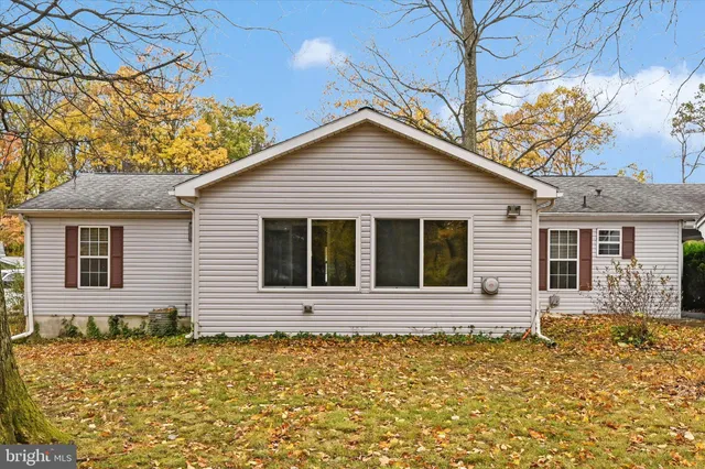 a front view of a house with large windows