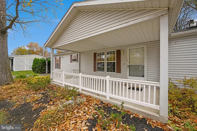 a view of a house with wooden fence