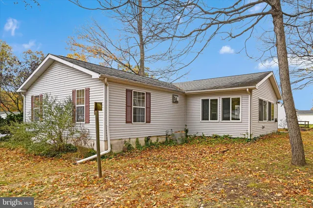 a house with trees in front of it