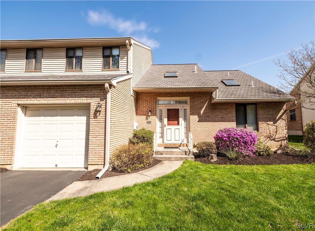 1201 Butztown Road, Unit 24 Bethlehem, PA 18017 - Photo 1 of 30 a front view of a house with a yard