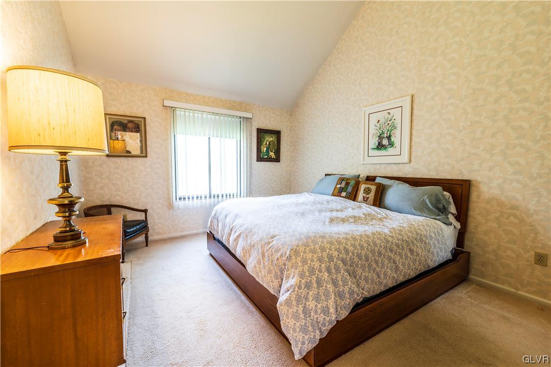 1201 Butztown Road, Unit 24 Bethlehem, PA 18017 - Photo 15 of 30 a bedroom with a bed and wooden floor