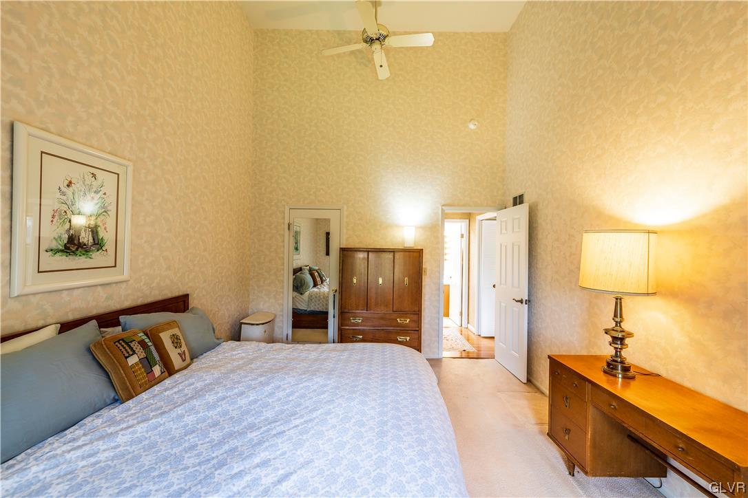 1201 Butztown Road, Unit 24 Bethlehem, PA 18017 - Photo 16 of 30 a bed room with a bed and a lamp