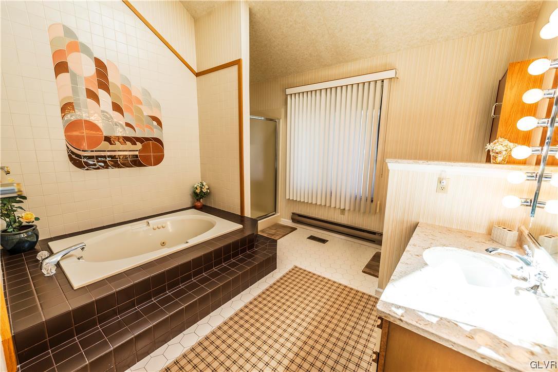 1201 Butztown Road, Unit 24 Bethlehem, PA 18017 - Photo 17 of 30 a bathroom with a bathtub and shower