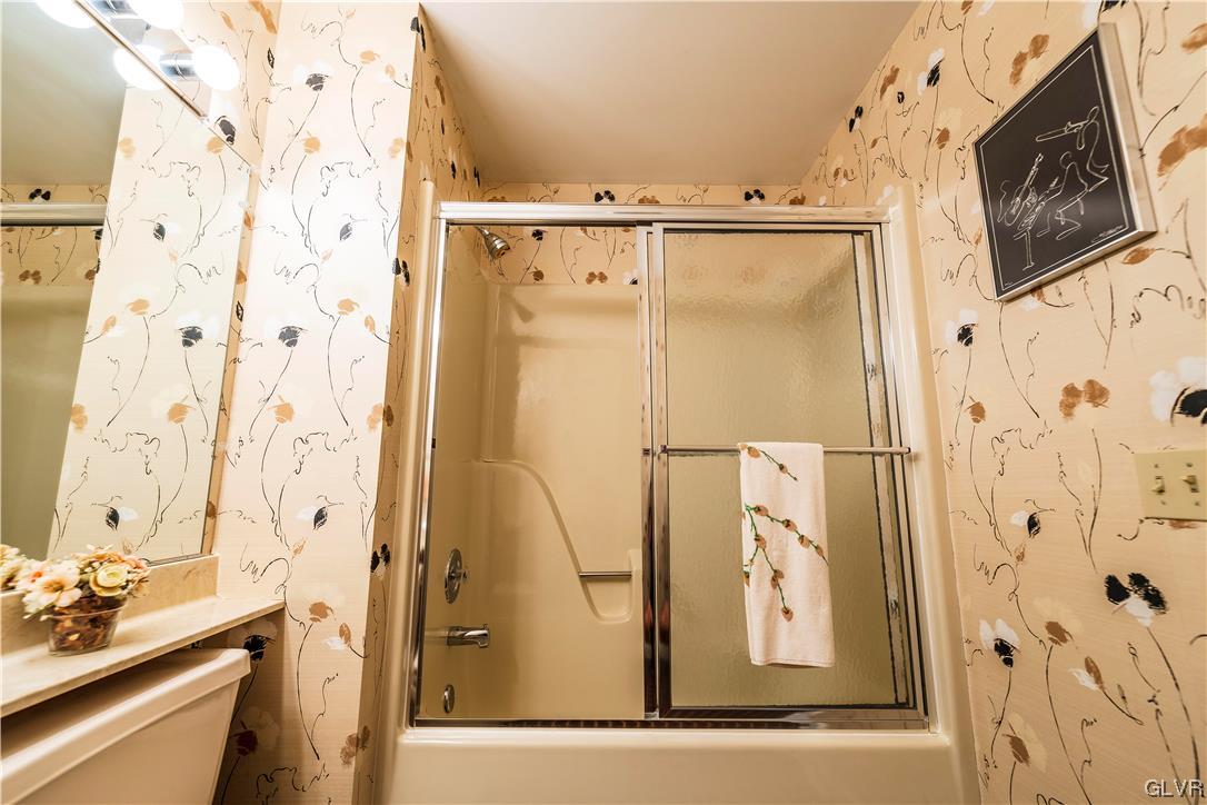 1201 Butztown Road, Unit 24 Bethlehem, PA 18017 - Photo 20 of 30 a bathroom with a shower sink and mirror
