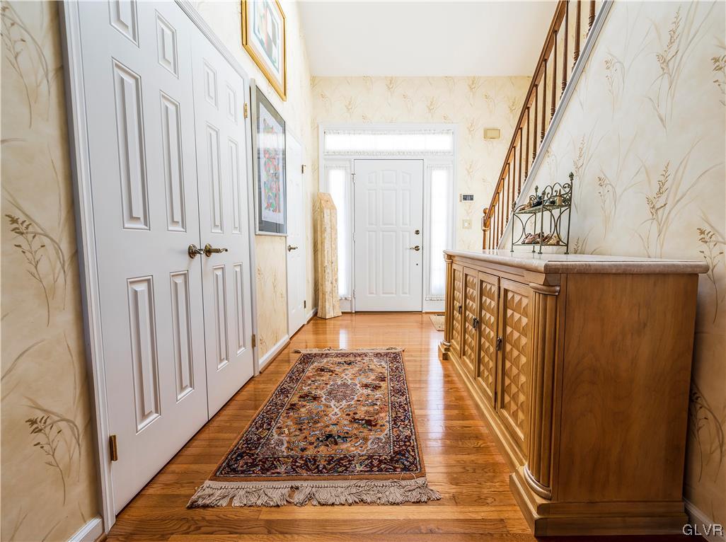 1201 Butztown Road, Unit 24 Bethlehem, PA 18017 - Photo 5 of 30 a view of a hallway with wooden floor and staircase