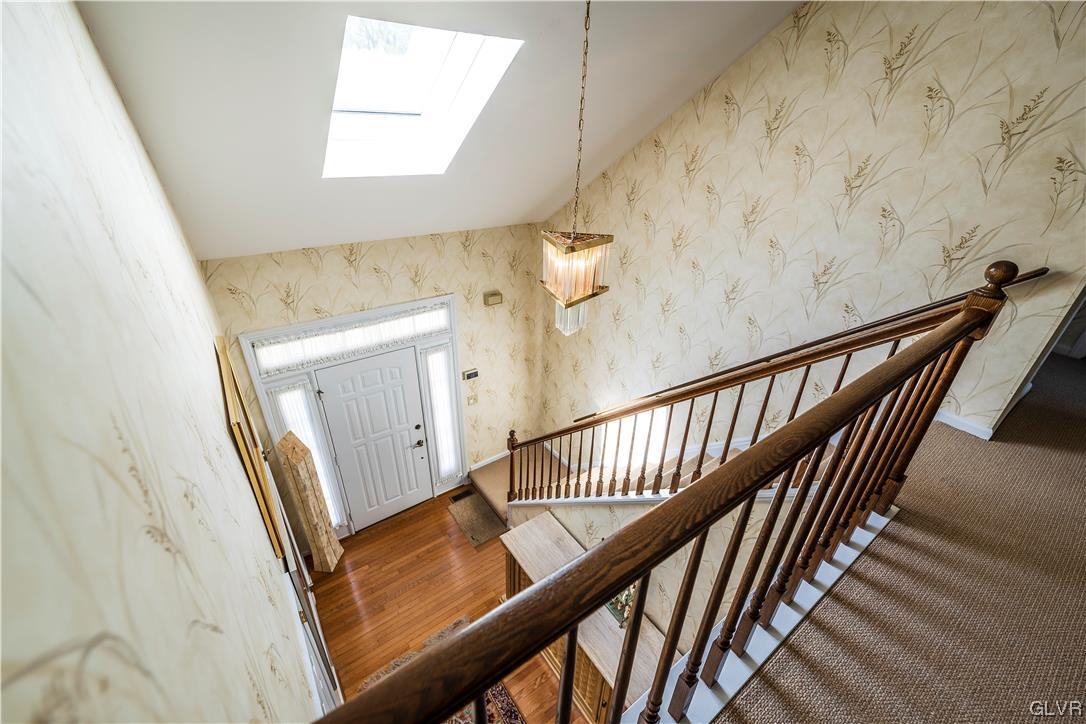 1201 Butztown Road, Unit 24 Bethlehem, PA 18017 - Photo 6 of 30 a view of a hallway with wooden floor and stairs