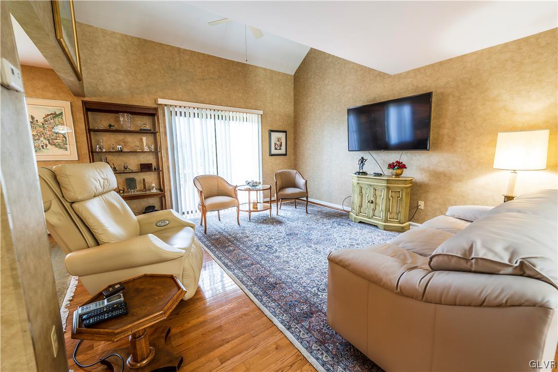 1201 Butztown Road, Unit 24 Bethlehem, PA 18017 - Photo 8 of 30 a living room with furniture and a flat screen tv