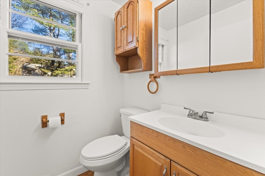 139 Burt Street, Unit 6 Norton, MA 02766 - Photo 12 of 31 a bathroom with a sink a toilet and a mirror