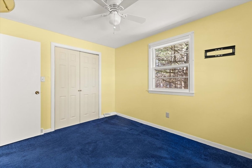 139 Burt Street, Unit 6 Norton, MA 02766 - Photo 27 of 31 a view of an empty room with wooden floor
