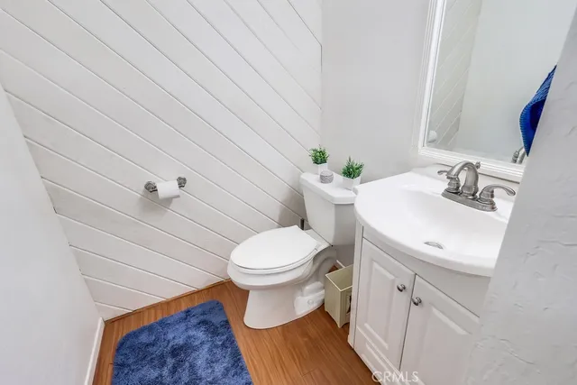 a bathroom with a sink toilet and vanity