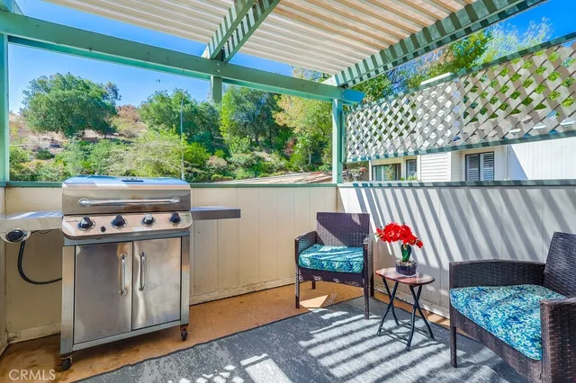 a view of an outdoor sitting area with furniture