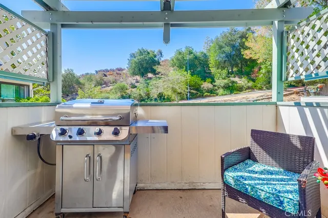 a view of an outdoor sitting area with furniture