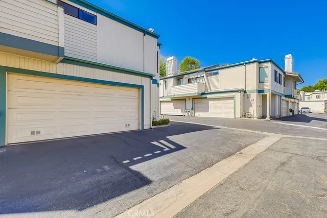 a front view of house with a garden and patio