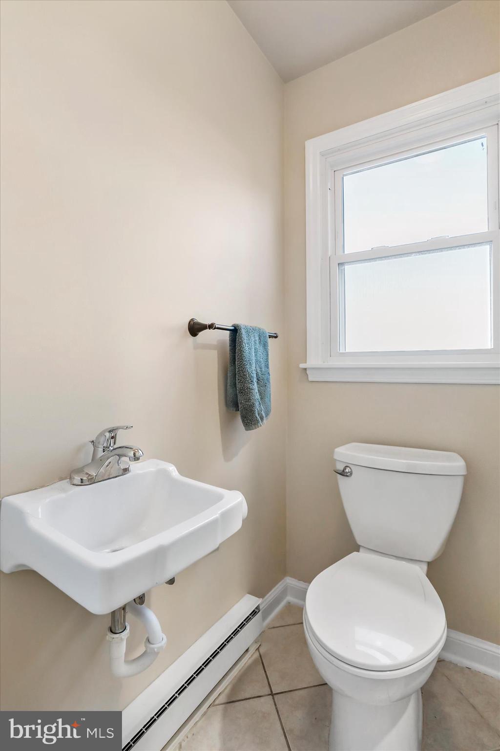 13728 Broadfording Church Road Hagerstown, MD 21740 - Photo 13 of 44 a bathroom with a sink a toilet and mirror
