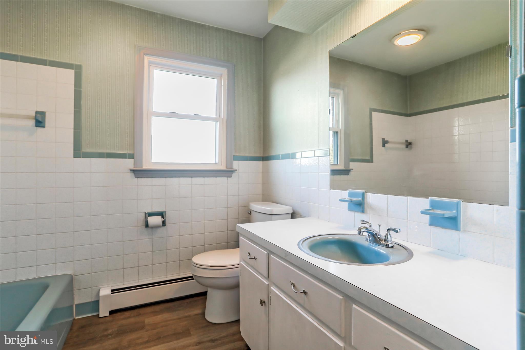 13728 Broadfording Church Road Hagerstown, MD 21740 - Photo 22 of 44 a bathroom with a sink a toilet and mirror