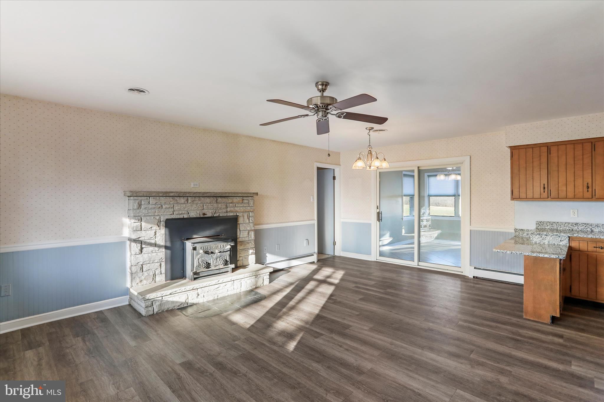 13728 Broadfording Church Road Hagerstown, MD 21740 - Photo 4 of 44 a view of an empty room with a fireplace and a window