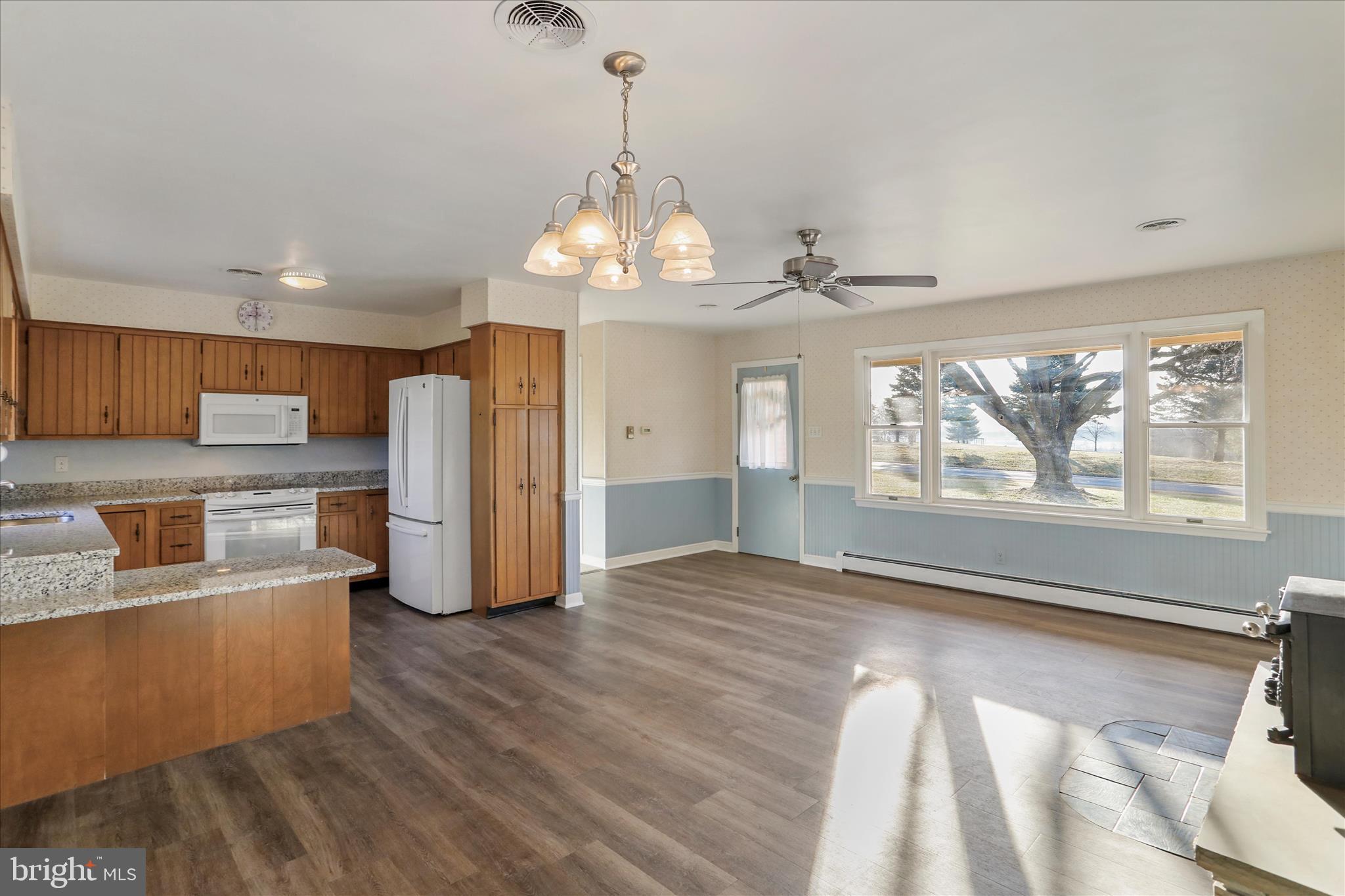 13728 Broadfording Church Road Hagerstown, MD 21740 - Photo 6 of 44 a view of a kitchen with granite countertop stainless steel appliances cabinets and a large window