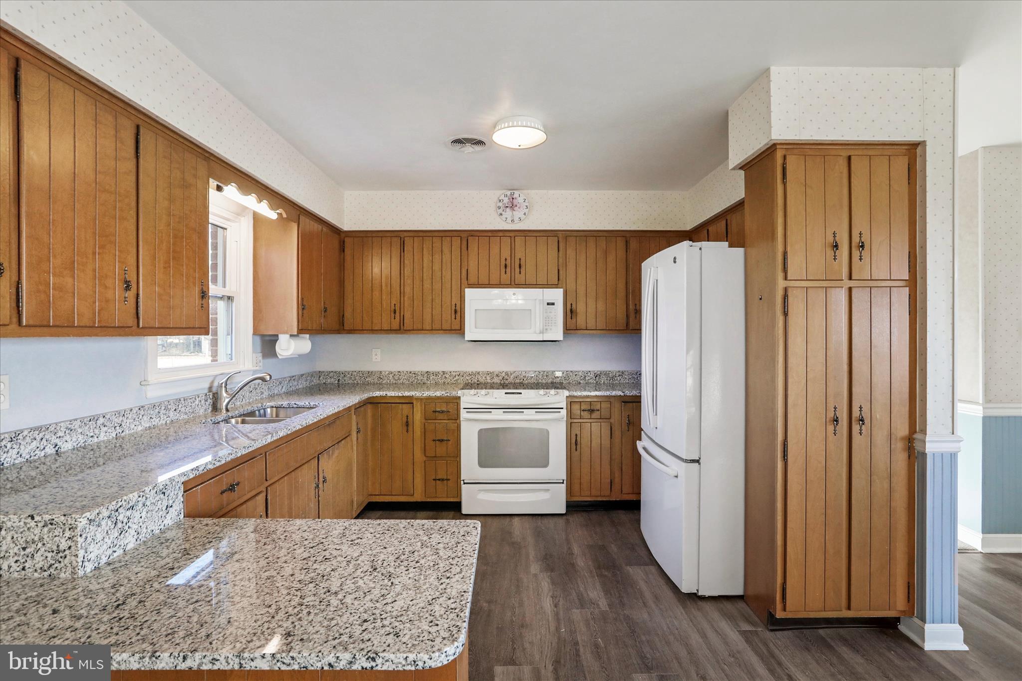 13728 Broadfording Church Road Hagerstown, MD 21740 - Photo 8 of 44 a kitchen with a refrigerator sink and cabinets