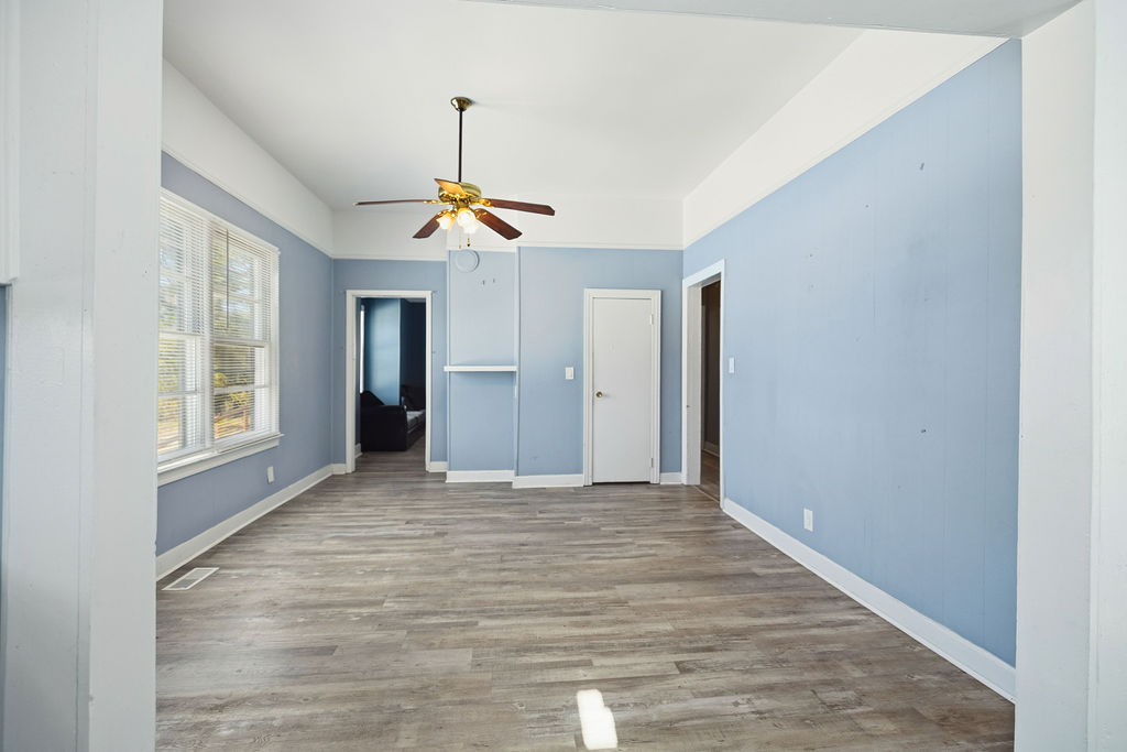215 Louisiana Street Honea Path, SC 29654 - Photo 14 of 26 Bright and airy living area with durable flooring and ample natural light.
