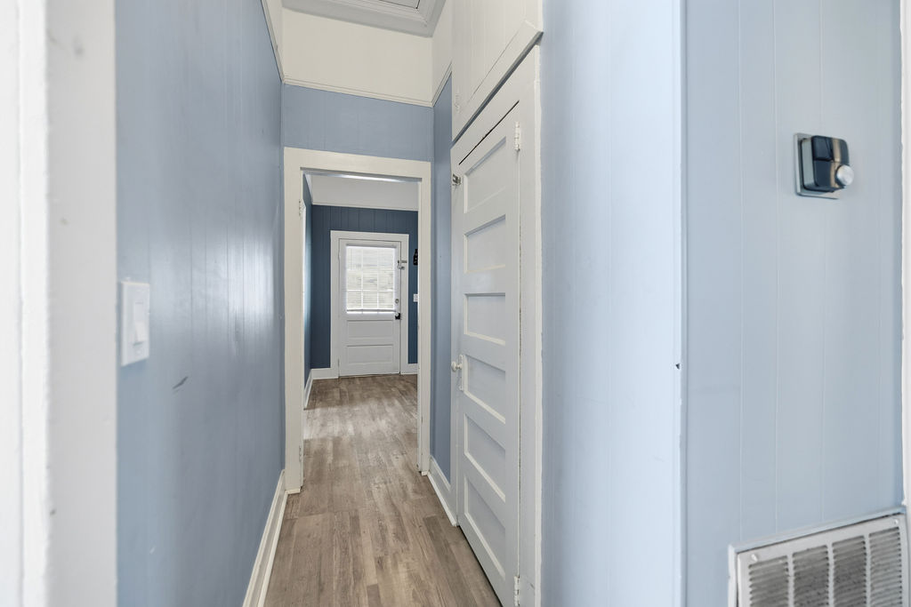 215 Louisiana Street Honea Path, SC 29654 - Photo 15 of 26 This interior hallway offers a clean and welcoming pathway to other rooms.